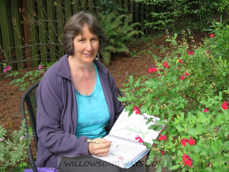 Journaling in the Garden Person nature journaling in the garden